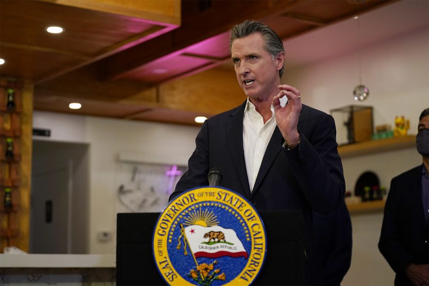California Gov. Gavin Newsom speaks at Hanzo Sushi Thursday, April 29, 2021, in San Fernando, Calif. Businesses could be spared billions of dollars of higher taxes in coming years as a result of federal coronavirus relief funds flowing to the states. Newsom announced a budget plan this spring that would use $1.1 billion from the latest federal COVID-19 relief law to bolster a depleted unemployment compensation accounts. (AP Photo/Marcio Jose Sanchez, file)